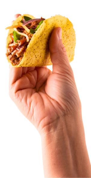 Juan's Authentic Mexican Restaurant Mississippi - A hand holding a hard shell taco filled with ground meat, shredded cheese, and vegetables against a white background—perfect for anyone craving authentic Mexican food in Biloxi, Mississippi.
